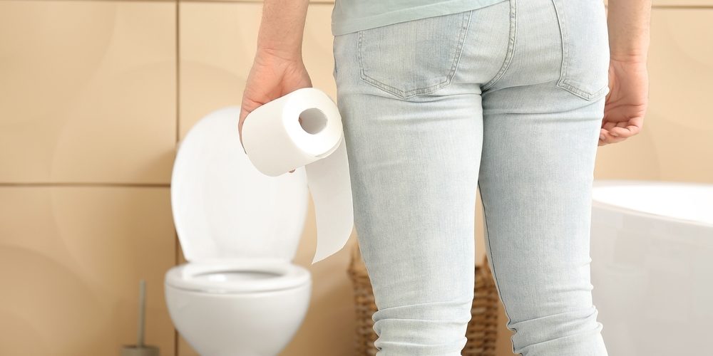 Young,Man,With,Toilet,Paper,In,Bathroom.,Hemorrhoids,Concept